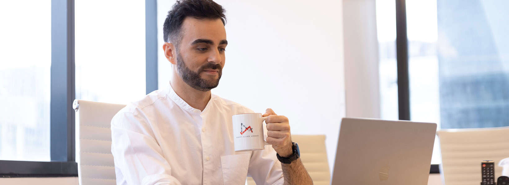a man holding a coffee mug