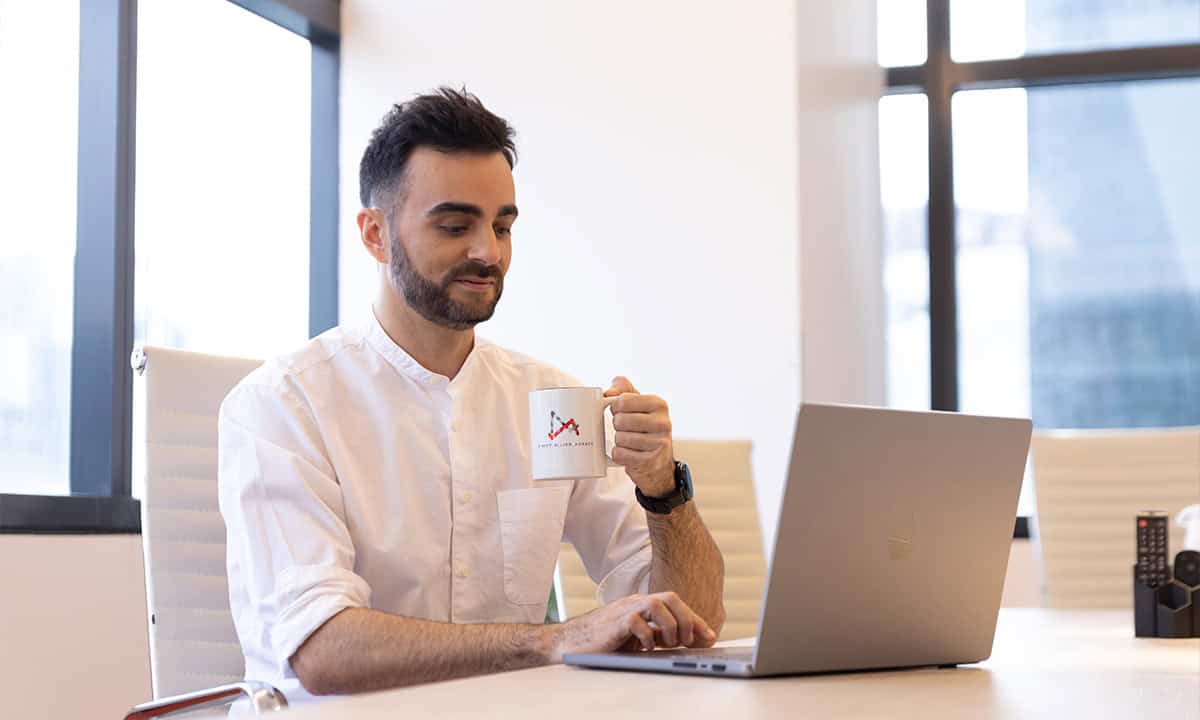 Man sipping coffee.