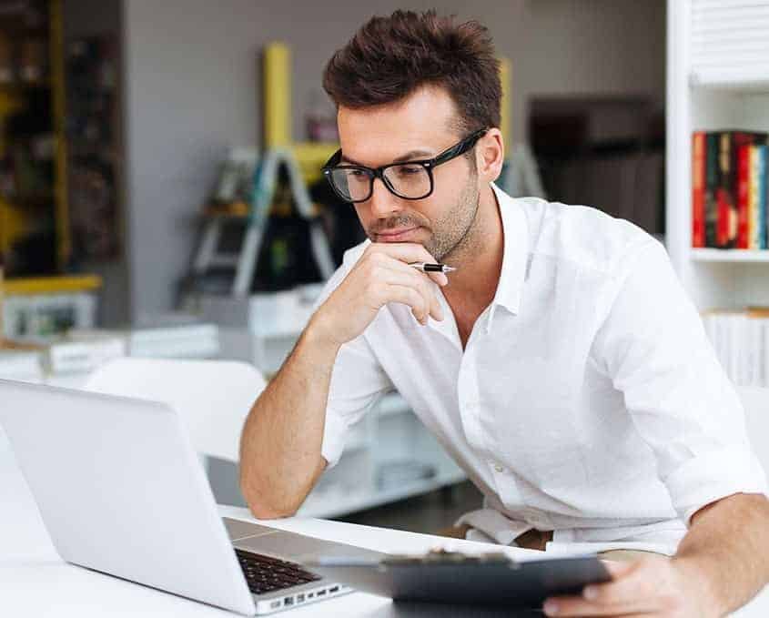 man looking at laptop